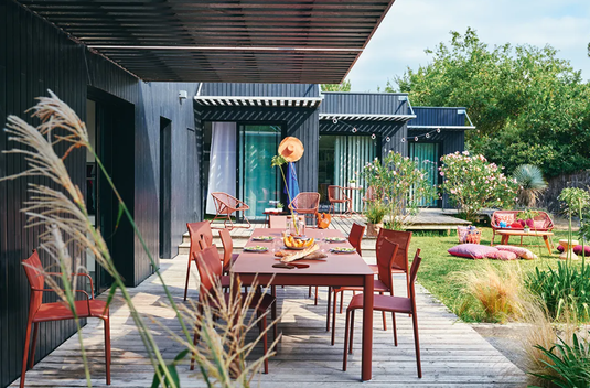 Fermob Ribambelle extendable metal table with two extensions, large 10-seater design, suitable for dining or gatherings.