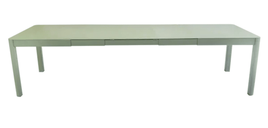 Large Fermob Ribambelle XL extendable metal table in cactus color, 14-seater, ideal for hospitality and dining spaces.