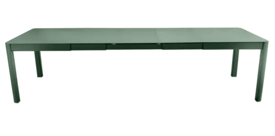 Fermob Ribambelle XL extendable metal table in cedar green, large 14-seater dining and hospitality furniture for events.