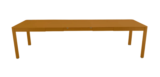 Fermob Ribambelle XL extendable metal table in gingerbread color, seating 14, perfect for large gatherings or hospitality spaces.