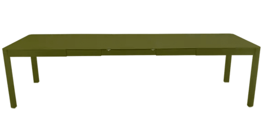 Large Fermob Ribambelle XL extendable metal table in pestogreen, seating 14, suitable for hospitality or large gatherings.
