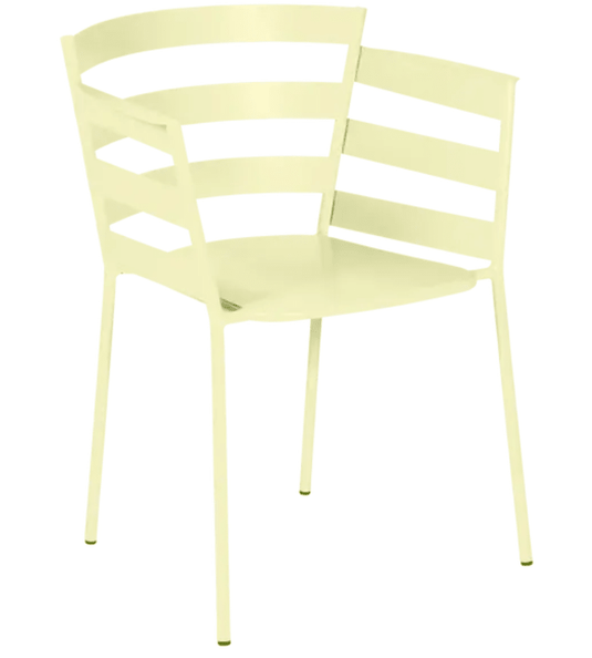 Fermob RYTHMIC outdoor armchair in frosted lemon color, featuring a modern design with a curved back and armrests.
