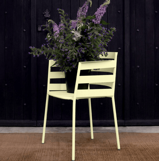 Fermob RYTHMIC outdoor armchair with colorful woven seat and metal frame, perfect for garden or patio seating.