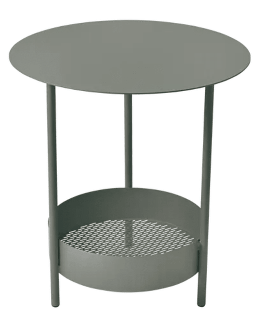 Fermob Salsa pedestal side table with round top, outdoor furniture piece in a garden setting, ideal for patio or balcony use.
