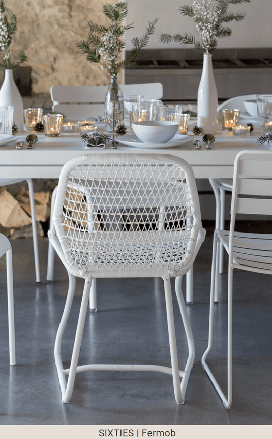 White Fermob Sixties outdoor stackable chair, stylish hospitality seating for outdoor restaurants and hospitality settings.