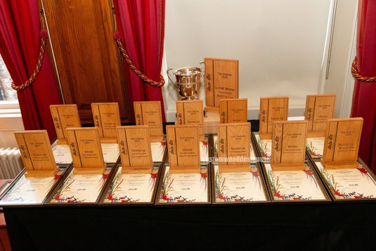 Sports Trophies Ireland - Custom Wood DesignsAssorted sports trophies from Custom Wood Designs displayed on a table, featuring various shapes and sizes for athletic achievements.Sport Trophies24575211339191