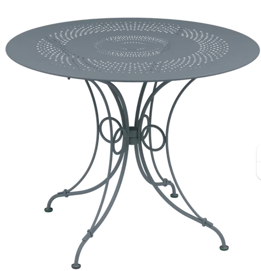 Fermob 1900 outdoor table with 96 cm diameter, round metal table for patio or garden use, weather-resistant design.