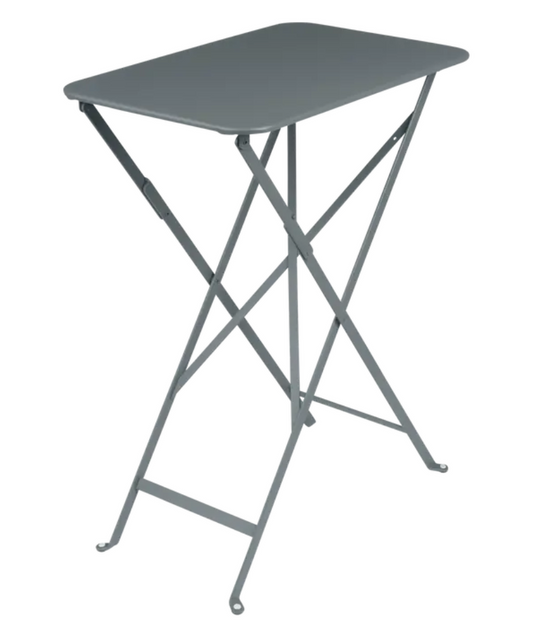 Fermob Bistro folding table in storm grey with rectangular metal surface, ideal for small restaurant terrace seating.