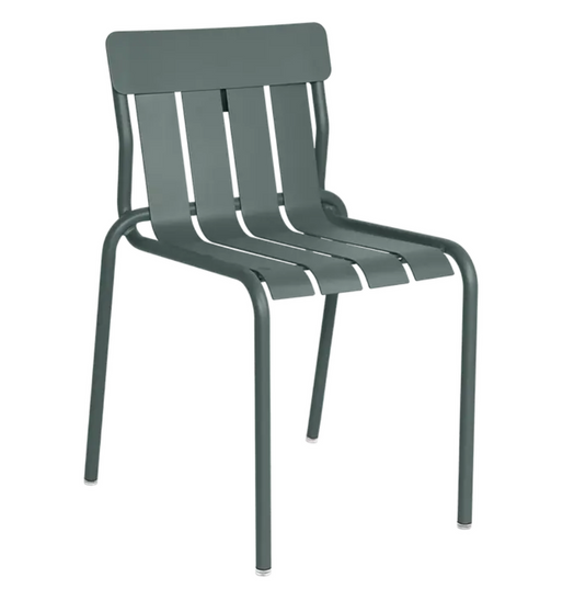 Storm grey Fermob stackable outdoor dining chair with metal frame, designed for outdoor use and hospitality settings.