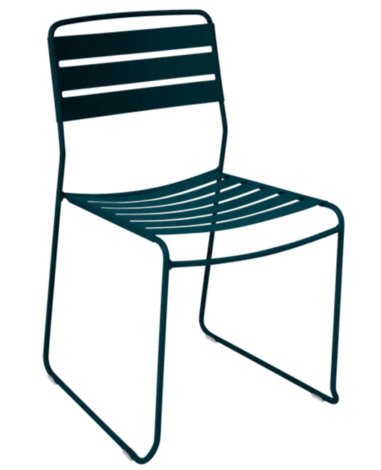 Blue Fermob Surprising outdoor chair with a curved metal frame, suitable for restaurant or patio outdoor seating.