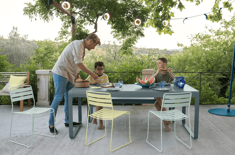 Load image into Gallery viewer, Fermob Surprising outdoor chair with sleek metal design and vibrant finish, perfect for patio or garden seating.
