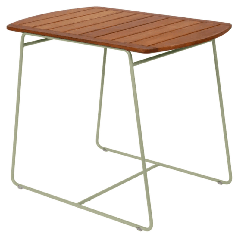 Load image into Gallery viewer, Fermob outdoor teak table, 90x60cm, with a smooth surface and modern design, shown in willow green finish.
