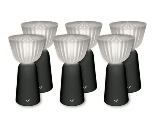 Set of six Fermob Swing outdoor rechargeable lamps in antracite, 20 cm height, arranged outdoors for ambient lighting.