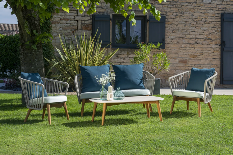 Fermob GORDES 2-Seater teak outdoor sofa on patio with cushions, stylish teak furniture for outdoor relaxation
