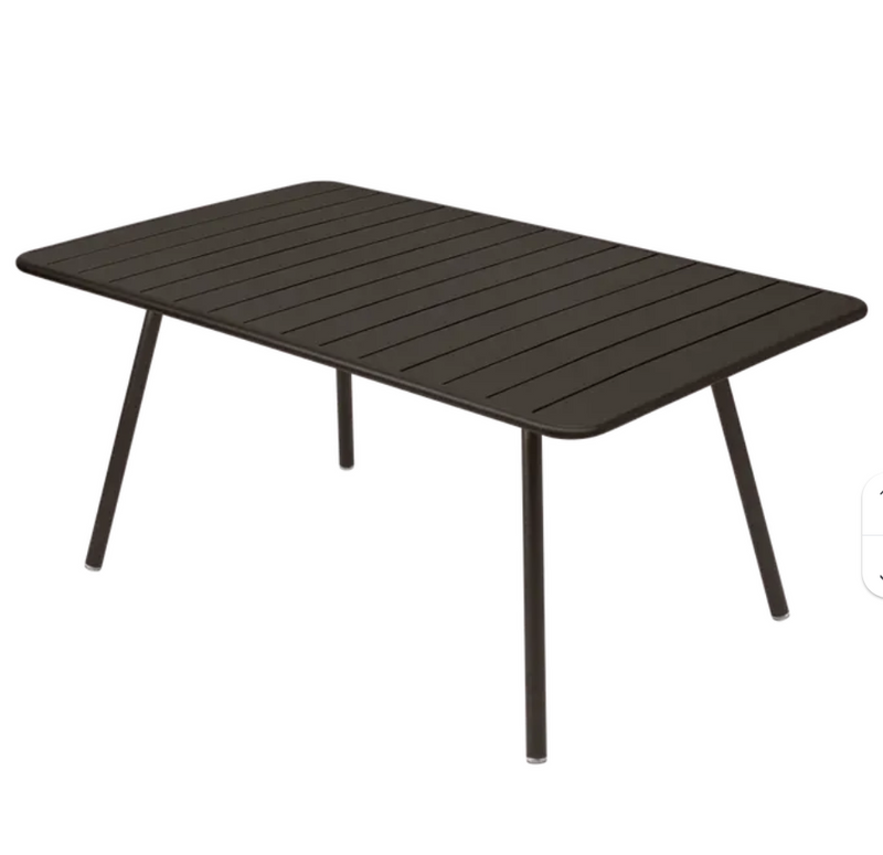 Load image into Gallery viewer, Fermob Luxembourg outdoor metal table, 165 x 100 cm, with a sleek modern design suitable for patio or garden use.
