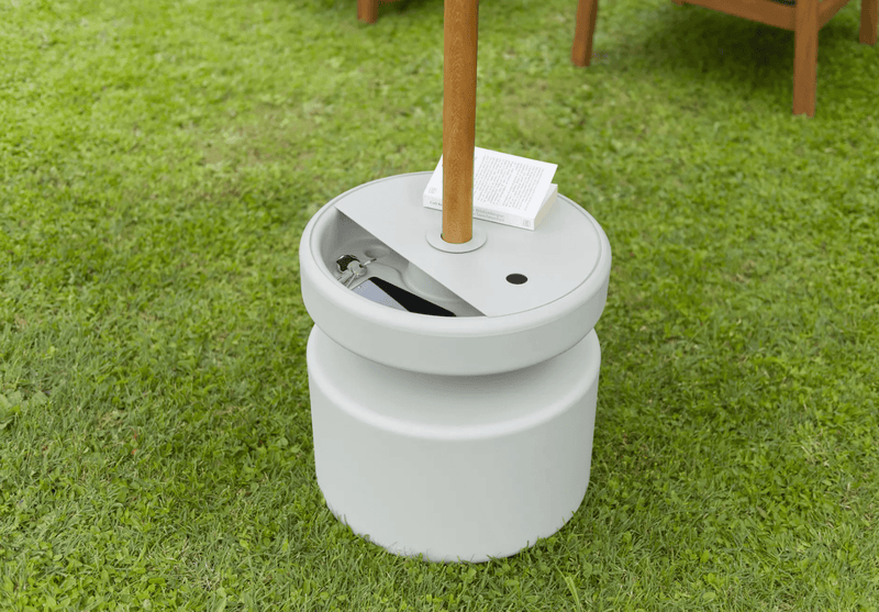 Load image into Gallery viewer, Fermob universal moulded parasol base with built-in storage compartment, designed for outdoor patio umbrellas.
