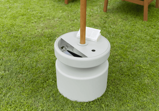 Fermob universal moulded parasol base with built-in storage compartment, designed for outdoor patio umbrellas.