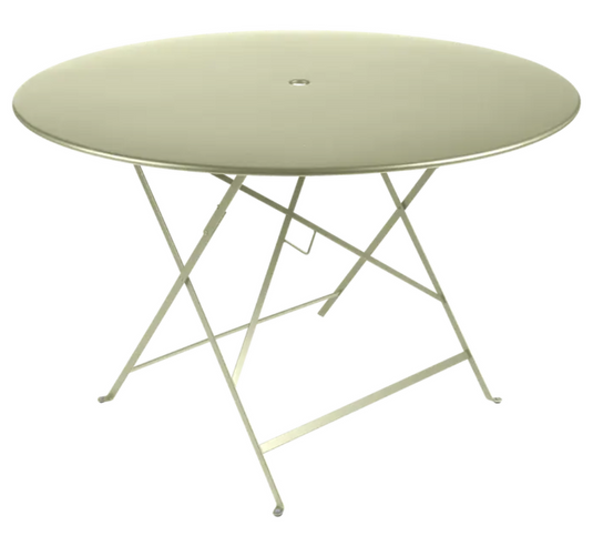 Willow green Fermob round outdoor dining table, 117cm diameter, six-seater metal bistro table for outdoor gatherings.
