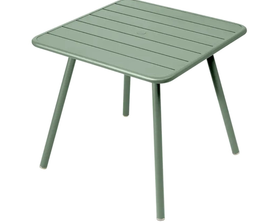Willow green Fermob Luxembourg 4-leg metal garden table, 80x80 cm, outdoor furniture for patio or garden spaces.